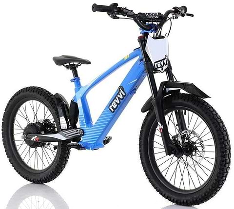 The Revvi 20" Kids Electric Balance Bike in blue, displayed on a white background, showcases durable off-road rubber tires, a black seat and handlebars, and a front white number plate. The brand "Revvi" is prominently etched on its frame.