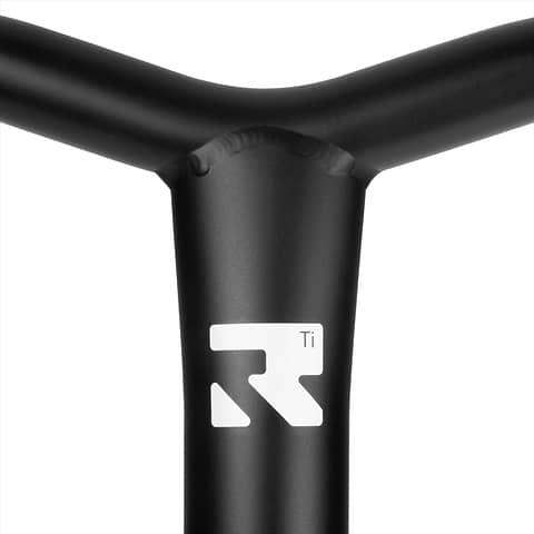 Close-up image of a black, T-shaped Root Industries AIR Titanium Oversized HIC Stunt Scooter Bar with a white logo featuring a stylized letter "R" and the text "Ti". The bar showcases smooth welds and a matte finish, ideal for durable stunt scooter rides.