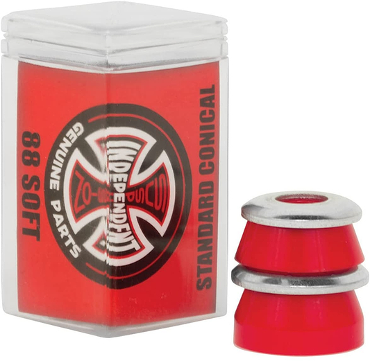 A clear container displays a set of Independent Standard Conical Red Skateboard Bushings - 88A, branded by Independent. The label reads "Independent Genuine Parts 88 Soft Standard Conical," emphasizing their High Rebound Urethane quality. Next to it, a vibrant red pair of conical bushings enhances the arrangement.