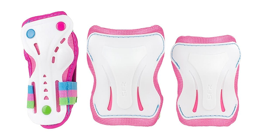 Introducing the SFR Essentials Junior Triple Skate Protection Pad Set - Candi, an entry-level gear in pink and white, featuring wrist guards with rainbow straps alongside elbow and knee pads. The white protective caps are stylishly accented in pink and blue to ensure both safety and flair.