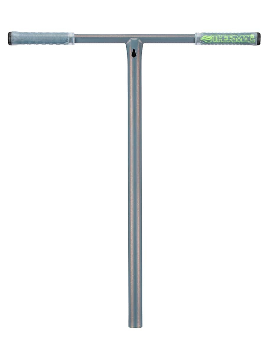 The sleek, metallic T-shaped Blunt Envy Thermal V2 Bronze stunt scooter bars showcase textured grips. These blue-gray grips include a transparent section that reveals a green design on one end, enhancing the durable steel construction of the Chromoly tube.
