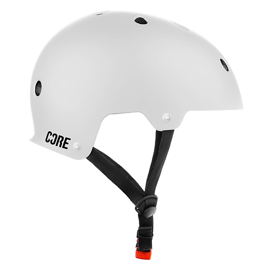 The CORE Action Sports Skate / Scooter Helmet - White features ventilation holes and a black adjustable chin strap—ideal for skating or scootering. Shown side-on against a plain background. Check our sizing guide for the best fit.
