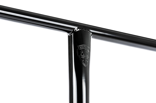 Close-up of Ethic DTC Tenacity V2 Steel Oversized HIC Stunt Scooter T-Bars—Black Mirror, 620mm x 600mm—showing the lightweight T-shaped handlebar with a small embossed shield-shaped "TENACI" logo at the joint.