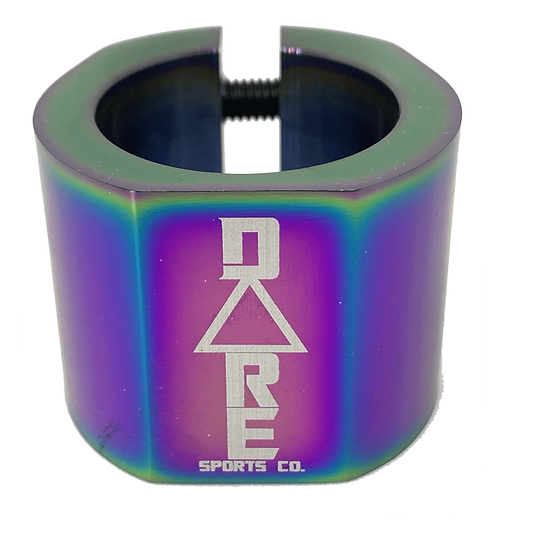 The Dare Warlord 2 Bolt Standard Stunt Scooter Clamp in Neochrome is a CNC machined, lightweight cylindrical clamp featuring a geometric design and the "DARE SPORTS CO." logo in white. It has a metallic, iridescent rainbow finish with a visible black screw at the top.