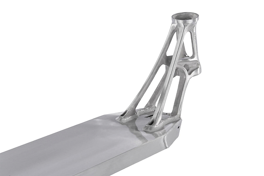 A close-up of the Ethic DTC Pandemonium V2 Raw Stunt Scooter Deck reveals a sleek, metallic scooter deck with a futuristic design and intricate, lightweight support structures. Made from 6061-T6 aluminum, its smooth, reflective surface accentuates advanced engineering and modern aesthetics.