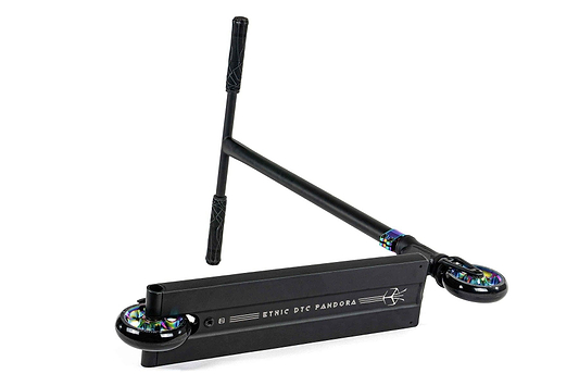 The Ethic DTC Pandora Complete Stunt Scooter (M) in Neochrome is a stylish freestyle scooter with a sleek black finish, featuring a flat deck branded "Ethic DTC Pandora." It comes equipped with two small wheels that have iridescent accents and a T-shaped handlebar with black grips, all set against a plain white background.