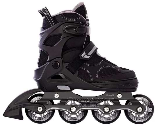 The Supreme Venice Adjustable Kids Inline Skates in Black/Grey feature four wheels, padded ankle support, and adjustable sizing straps, making them ideal for beginner-friendly recreational use.