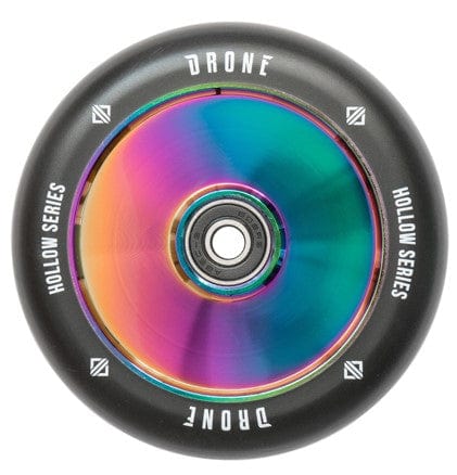 Introducing the Drone Hollow Core Series 110mm Stunt Scooter Wheel in Neochrome by Drone, a lightweight, multi-colored scooter wheel boasting a metallic rainbow finish. It features a visible central bearing and is encased by a sleek black outer rim with an eye-catching hollowcore design.