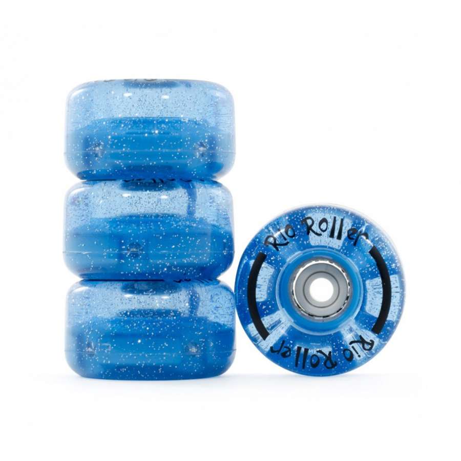 Four translucent blue glitter Rio Roller Light Up 82A Quad Roller Skate Wheels (58mm x 33mm) are shown—three stacked, one upright showcasing the “Rio Roller” branding and bearing. Ideal for vibrant outdoor skating.