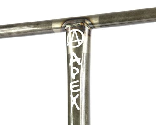 A close-up of the metallic T-shaped handlebar on the Apex XXL Steel Oversized SCS Stunt Scooter highlights the engraved "APEX" signature and stylized "A" logo on its 4130 Chromoly Steel. The street style bar, measuring 730mm x 660mm in a clear raw finish, reveals precise weld marks that underscore its robust design.