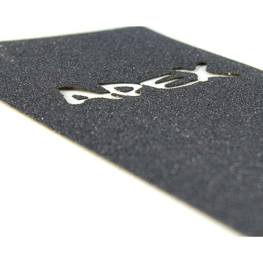 Close-up of Apex Pro Scooter Griptape - Laser Cut by Apex, revealing the board underneath. The coarse, grippy texture provides excellent traction for riders. Its strong adhesive secures it firmly, and the white background sharply contrasts with the dark griptape.
