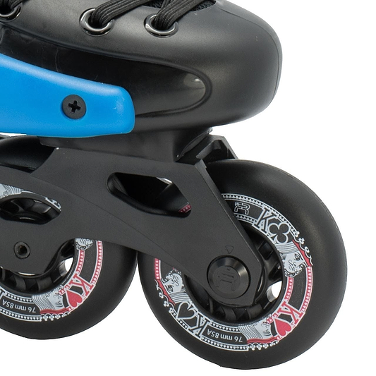 Close-up of a pair of FR Skates Junior Adjustable Inline Skates - Black, featuring black polyurethane wheels with a red and white design. The frame is black with a blue accent, showing part of the boot and laces above.