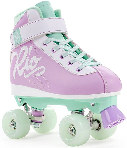 The Rio Roller Milkshake Quad Roller Skates in Mint Berry blend retro trainer skate style with pastel colors. Sporting a fashionable purple and mint design, they feature white laces and pale green wheels, with "Rio" prominently showcased in bold white letters on the side.