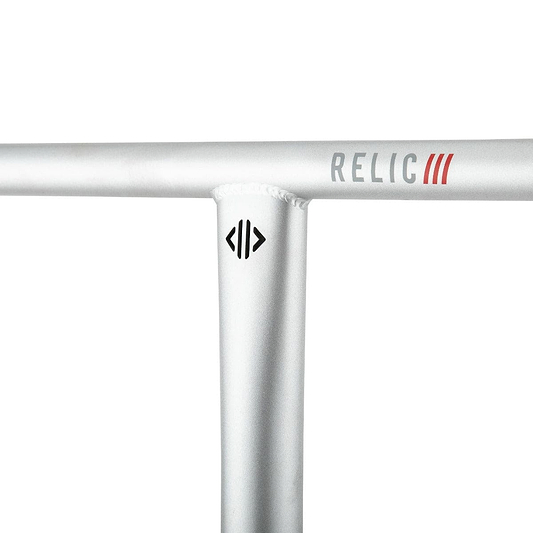 Close-up of the Drone Relic 3 Steel Oversized SCS Stunt Scooter Bars crafted from Chromoly 4130 steel in silver, featuring the word "RELIC" and three red lines. Below, a black logo resembling stylized arrows is visible. These handlebars by Drone have a smooth, metallic finish.