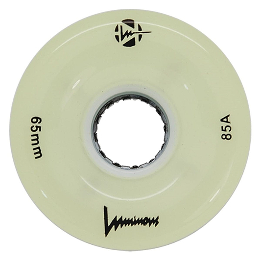 A cream-colored Luminous LED 85A Quad Roller Skate Wheel (White Glow, 65mm) has "65mm" and "85A durometer" printed on it, a central axle hole, the Luminous brand name, and black logos.