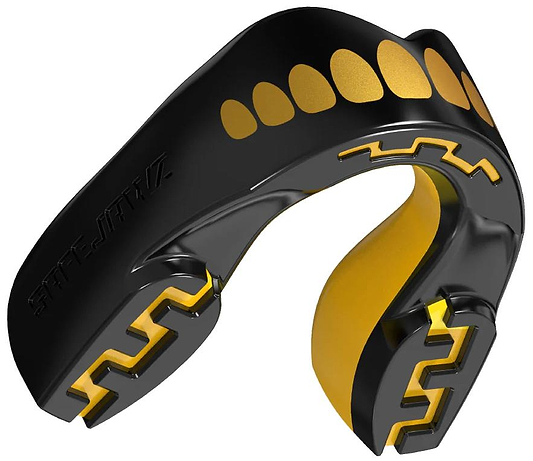 The Safejawz Extro Series Protection Mouthguard - Goldie by Safejawz features a black and gold design with a tooth-like pattern and jagged grooves, engineered for high-impact protection during sports.