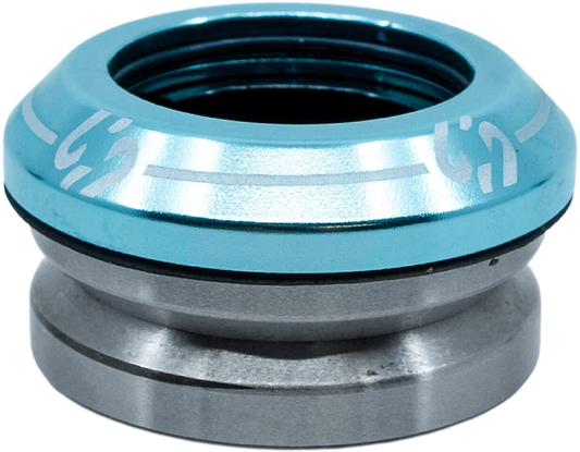 A close-up of the CORE Icon Integrated Stunt Scooter Headset - Blue by CORE, showing its blue anodized top cap and silver lower section—designed for smooth steering and compatibility with high-quality scooter bearings.