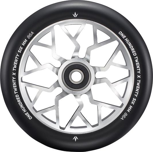 A close-up of the Blunt Envy Sector 120mm Stunt Scooter Wheel - Silver features a black and silver design with geometric spokes. The edge is marked with “ONE HUNDRED TWENTY X TWENTY SIX MM 86A.”.