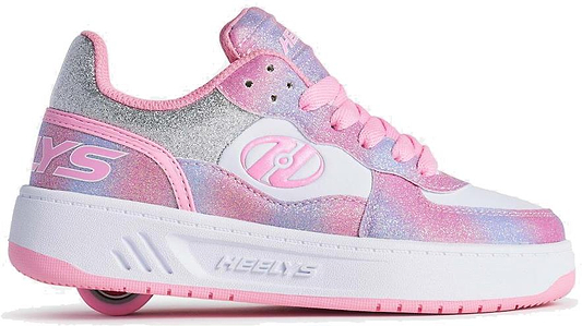 The Heelys Rezerve Low Girls Shoes in Lt Pink/White/Rainbow feature a glittery design, pink laces, the Heelys logo on the side, and a visible wheel in the chunky white sole—perfect for beginners.