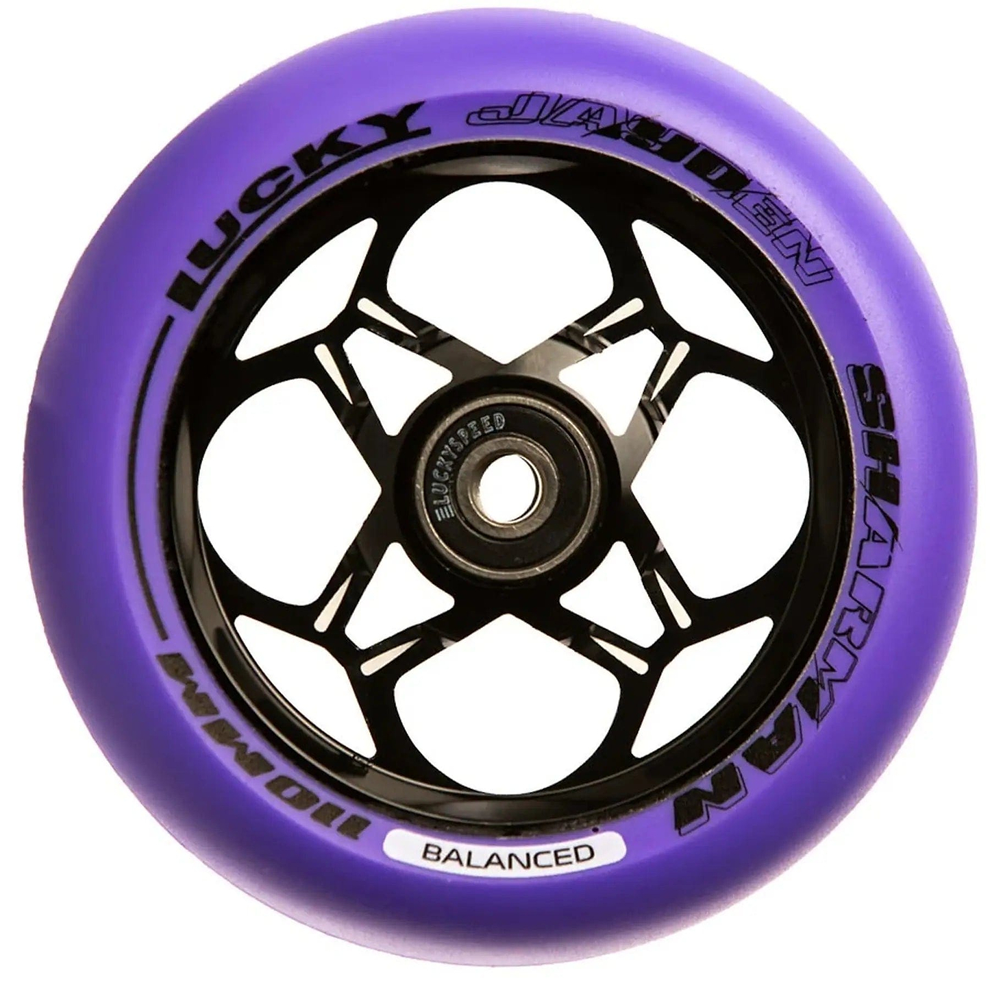 The Lucky Jayden Sharman Signature V3 Stunt Scooter Wheel in purple features a black core with star-like spokes, brand text "Lucky" and "Jayden," and includes Lucky Speed Bearings in its exposed central hub for enhanced performance.