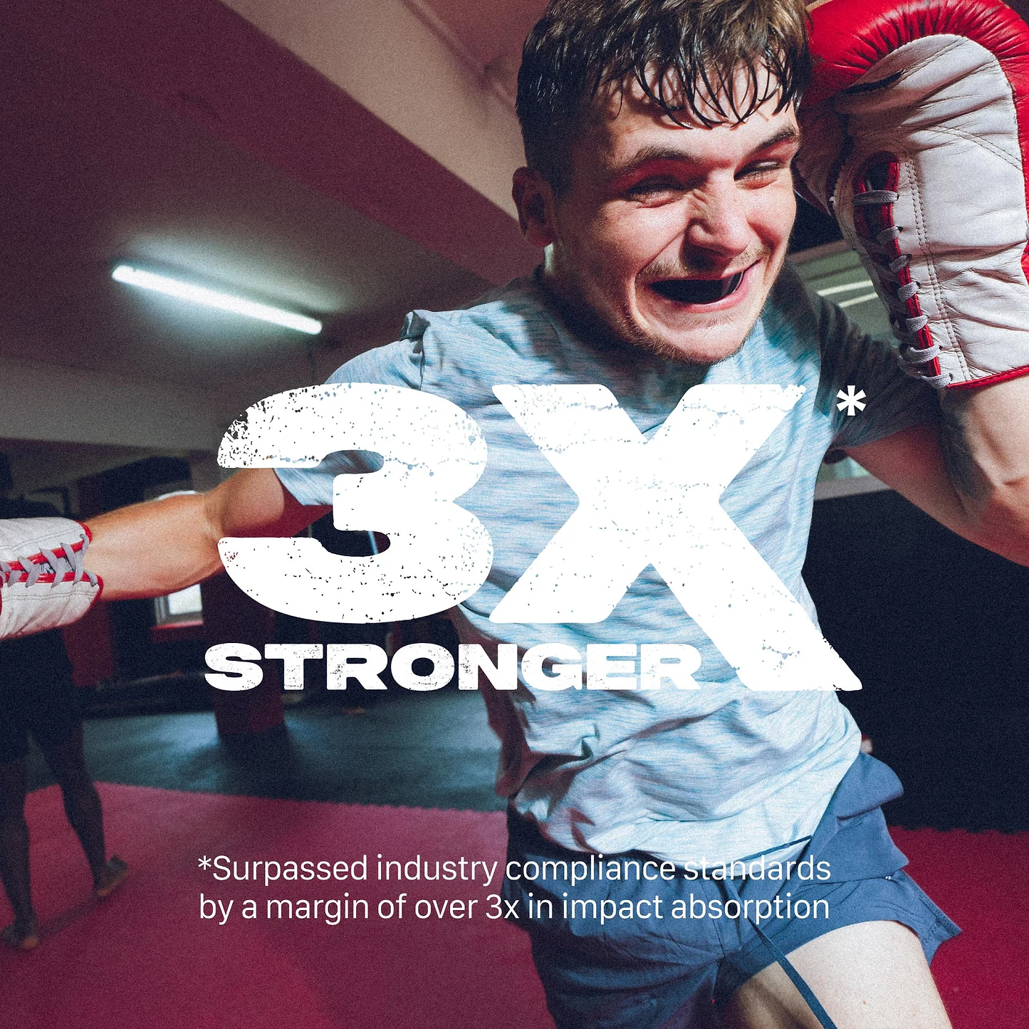 A young male boxer in a gym throws a punch wearing gloves and the Safejawz Intro Series Protection Mouthguard - Black. Large text reads "3X STRONGER." Smaller text: "*Surpassed industry compliance standards by over 3x in impact absorption.