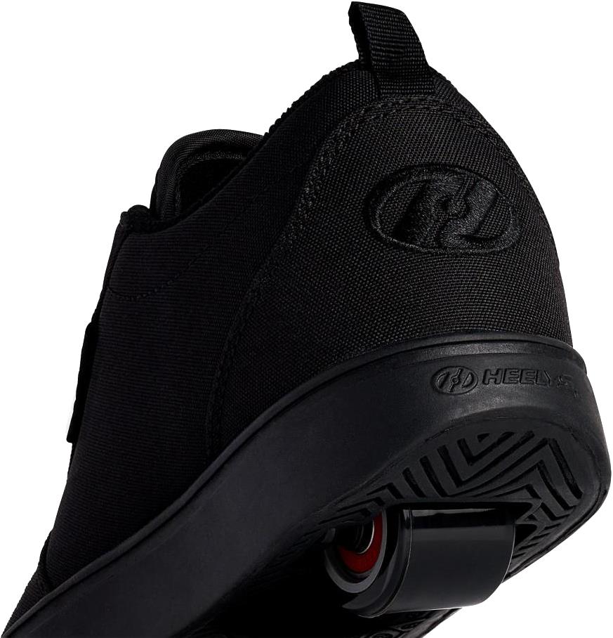 Close-up of Heelys Pro 20 Boys Shoes - Triple Black Canvas viewed from the back, showing the wheel in the sole and Heelys logo on the side and back.