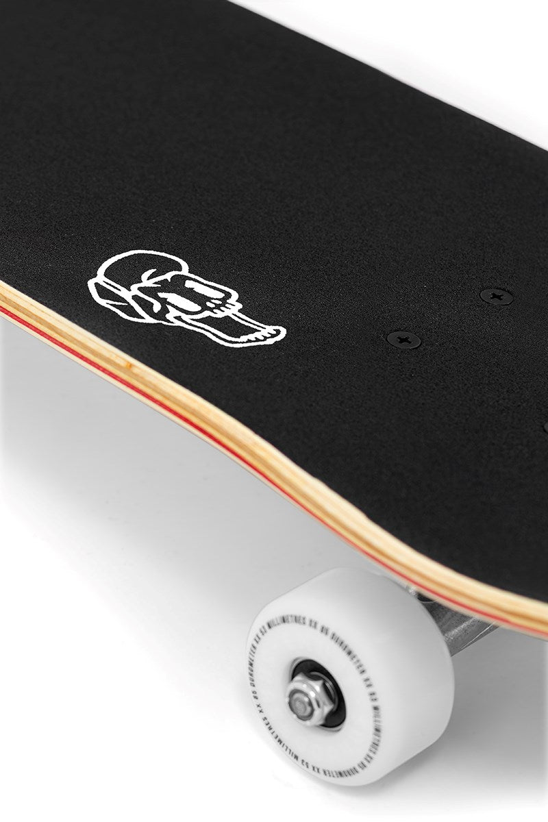 A close-up of the Enuff Meltworld Mini Dazed Complete Skateboard (7.25" x 29.5") shows white wheels, black grip tape, and a bold deck graphic—perfect for young riders looking for their first Enuff skateboard.