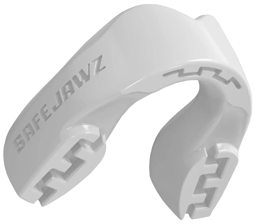 The Safejawz Intro Series Protection Mouthguard - White by Safejawz features grooved edges, a curved shape for comfort and jaw stability, and "SAFEJAWZ" embossed on the side.
