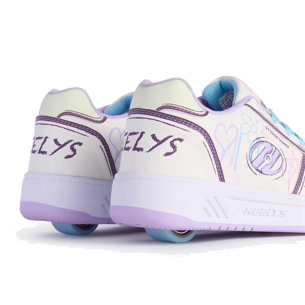 Heelys Kama Colour Changing Girls Shoes in white, lilac, and blue by Heelys, shown from the back with visible wheels in the heels. These kids’ shoes feature heart doodles and purple details.