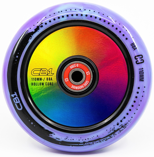 A close-up of the CORE CB1 110mm Nylon Stunt Scooter Wheel in Black/Neochrome, featuring a vibrant hollow core and "ABEC-9" bearing—ideal for beginner riders seeking stylish and reliable performance.