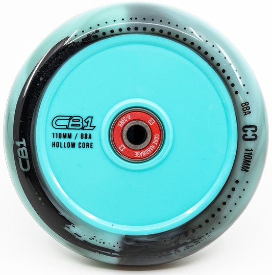 Close-up of the CORE CB1 110mm Nylon Stunt Scooter Wheel in Black/Teal, featuring a hollow core, red bearing, and glossy finish—ideal for beginner riders.