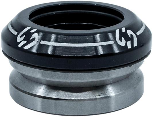 A close-up of the CORE Icon Integrated Stunt Scooter Headset in black, featuring durable bearings and white markings on the top cap, designed by CORE for smooth rotation in stunt scooter steering tube assemblies.