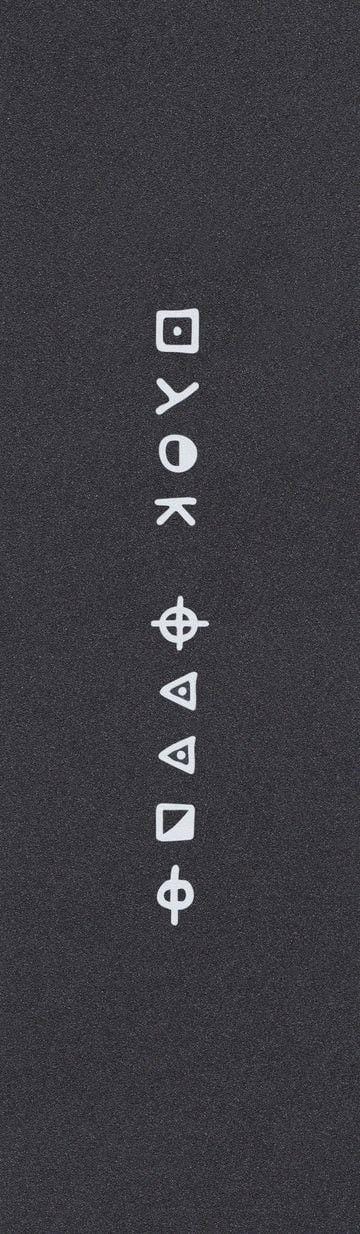 White geometric shapes—squares, circles, triangles, arrows, and more—form a vertical column on the Hella Grip Classic Stunt Scooter Griptape - Zodiac by Hella Grip, set against a dark gray background.