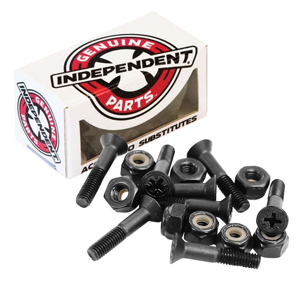 A box labeled "Independent Phillips Skateboard Bolts - Black 1" is open, revealing several black screws with flat heads and extended unthreaded shafts, alongside hexagonal nylon lock nuts scattered for skateboard assembly.