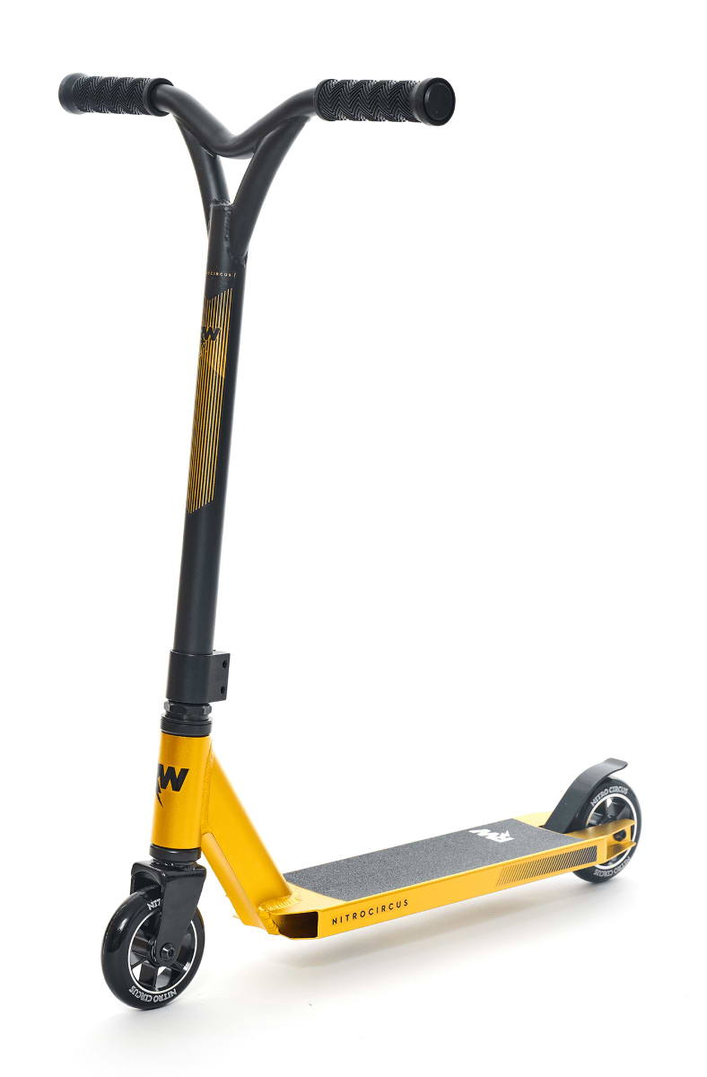 The Nitro Circus Ryan Williams Junior Replica Complete Stunt Scooter in gold and black is a striking piece with a T-bar handle, durable black wheels, and a sleek deck adorned with graphics. Inspired by Ryan Williams and Nitro Circus, it's crafted for executing tricks while boasting a minimalist, modern design.