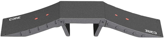 The CORE Mini Funbox Ramp Set - 2 Kickers & Flat Deck is a black plastic ramp by CORE, featuring two sloped sides, "CORE" in white on both ends, red dots, support legs under the platform, and a modular design.