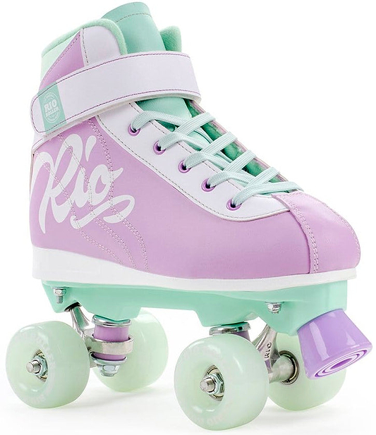 The Rio Roller Milkshake Quad Roller Skates in Mint Berry blend retro trainer skate style with pastel colors. Sporting a fashionable purple and mint design, they feature white laces and pale green wheels, with "Rio" prominently showcased in bold white letters on the side.