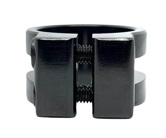 Introducing the Revolution Super Lite 2 Bolt Oversized Stunt Scooter Clamp in Black by Revolution, a uniquely designed industrial piece crafted from durable 6061-T6 aluminum. It features two flat, rectangular sections connected at the center by visible threaded screws.