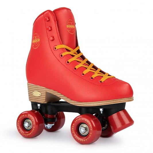 The eye-catching Rookie Classic 78 Quad Roller Skates - Red by Rookie showcase vivid red quad skates with contrasting yellow laces, sleek red wheels, and a robust black base. Additionally, they are vegan-friendly!