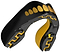 The Safejawz Extro Series Protection Mouthguard - Goldie by Safejawz features a black and gold design with a tooth-like pattern and jagged grooves, engineered for high-impact protection during sports.