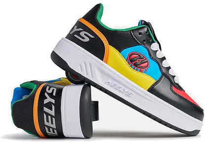 Two Heelys Rezerve Low Boys Shoes—one upright, one on its side showing the wheel—feature black, red, cyan, and yellow panels with white laces and soles. Brand: Heelys.