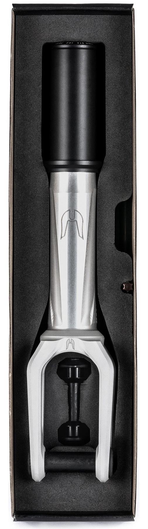 The Ethic DTC Merrow V3 8/12STD IHC Stunt Scooter Fork in Raw is displayed vertically in black foam packaging, showing its brushed silver finish and black top cap and bolts inside a rectangular box.