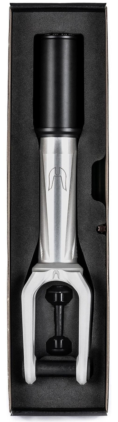 The Ethic DTC Merrow V3 8/12STD IHC Stunt Scooter Fork in Raw is displayed vertically in black foam packaging, showing its brushed silver finish and black top cap and bolts inside a rectangular box.
