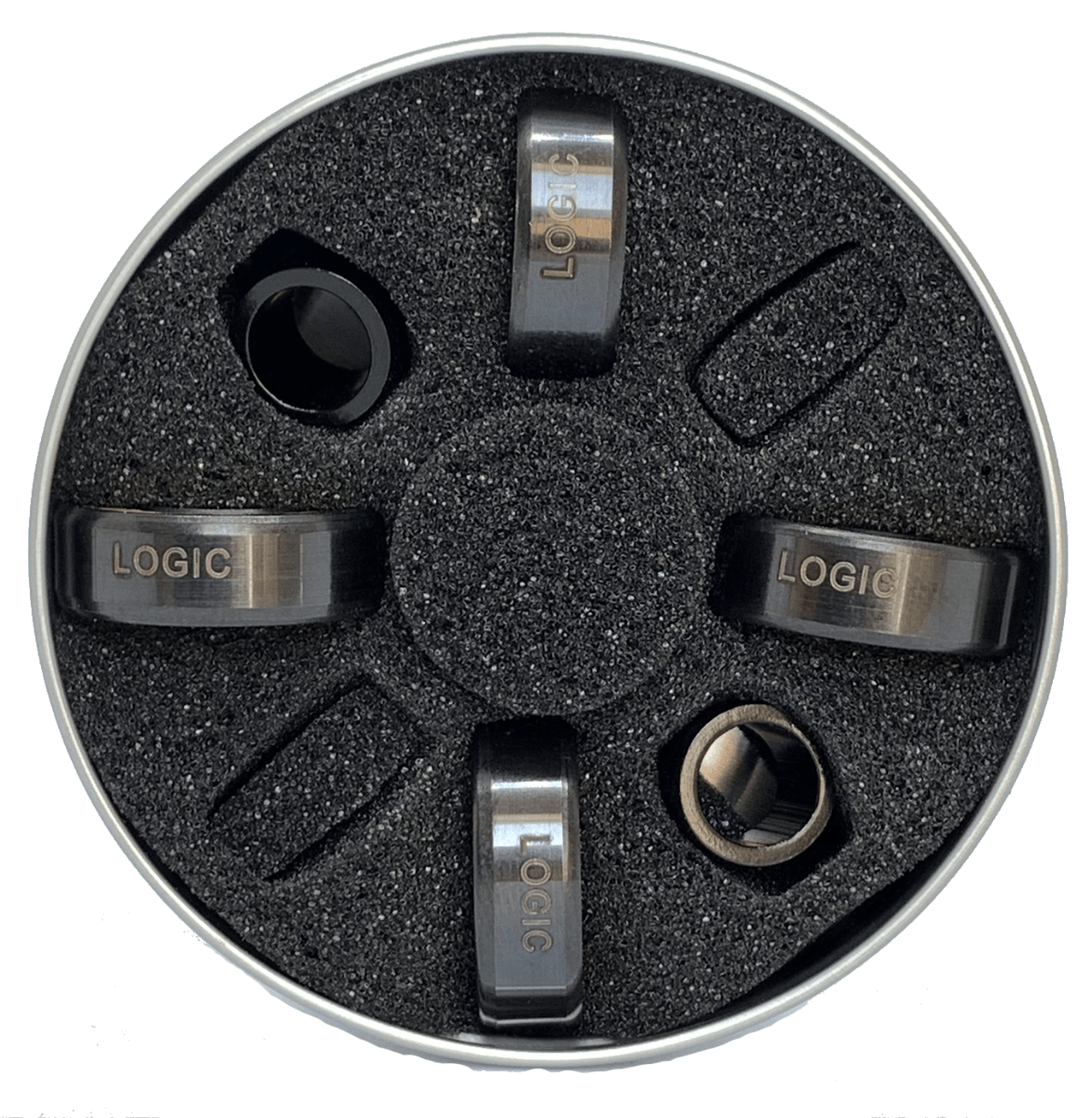 A circular foam container holds four black metallic rings, each engraved with "LOGIC" and nestled in its own slot. These premium quality Logic ABEC 11 Blue Scooter Bearings are arranged evenly around the central axis, enhancing performance speed with every ride.