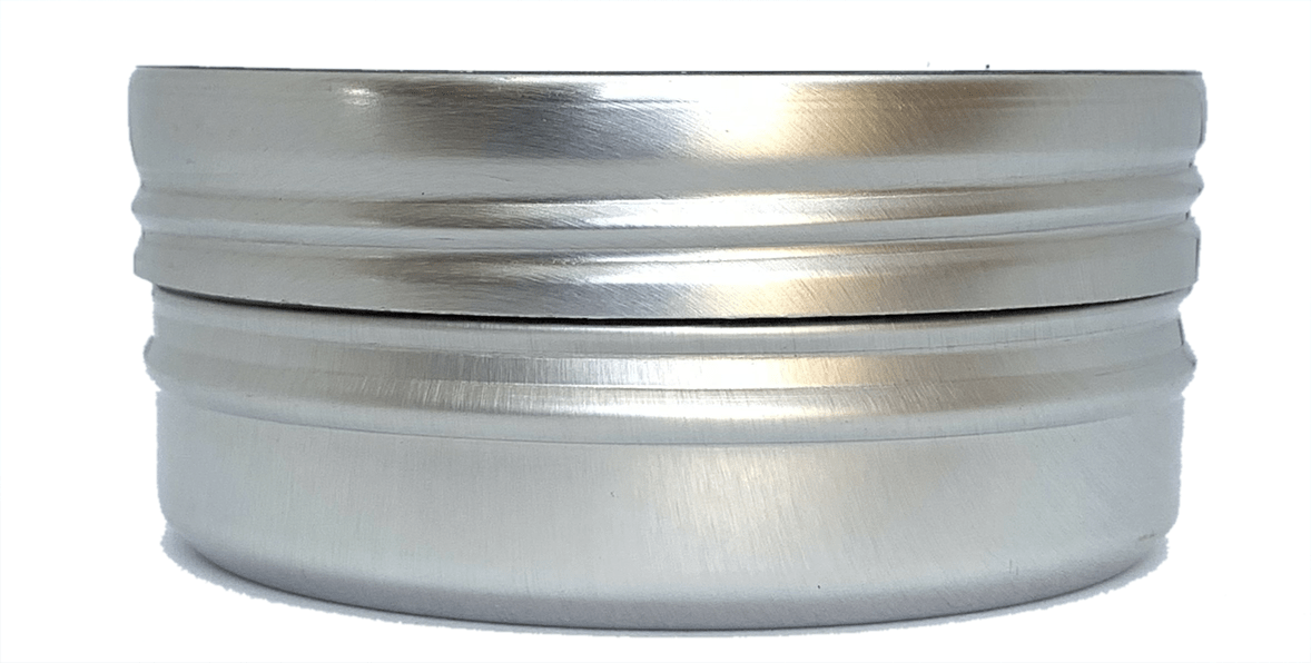 The Logic ABEC 11 Blue Scooter Bearings - 4 Pack come in a premium-quality, metallic, cylindrical container with a brushed finish and ridged design. The container is perfect for storing precision components such as scooter bearings and features a lid that seamlessly complements its smooth, silver surface.