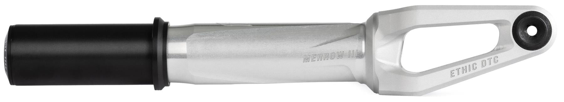 The Ethic DTC Merrow V3 8/12STD IHC Stunt Scooter Forks in Raw feature a silver and black finish, cylindrical section on one end, a cutout near the other, "ETHIC DTC" engraving, and are compatible with 12STD setups.