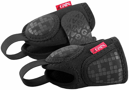 A pair of black GAIN Protection Pro Junior Ankle Protectors with padded support and red GAIN tags. Designed for impact protection, these junior ankle protectors feature a textured surface for better grip during sports or training.