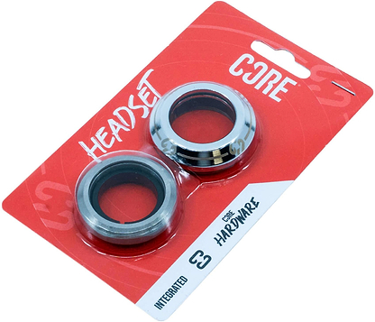 The CORE Icon Integrated Stunt Scooter Headset - Chrome includes two metal bearings, packaged on a red and white CORE card labeled "HEADSET" and "HARDWARE," with the CORE Icon logo and a hanging hole at the top.