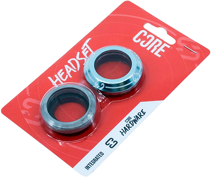 A blue and white retail package labeled "CORE Icon" features two metal bearings for stunt scooter headsets by CORE, with the text "Headset," "Integrated," and "CONE HARDWARE.