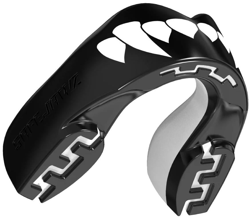The Safejawz Extro Series Protection Mouthguard - Fangz by Safejawz is a black and white mouthguard with a white fang design on the front and jagged cushioning patterns inside for hi-impact protection.